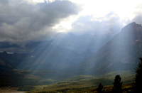 Rays of sunlight on a valley floor.